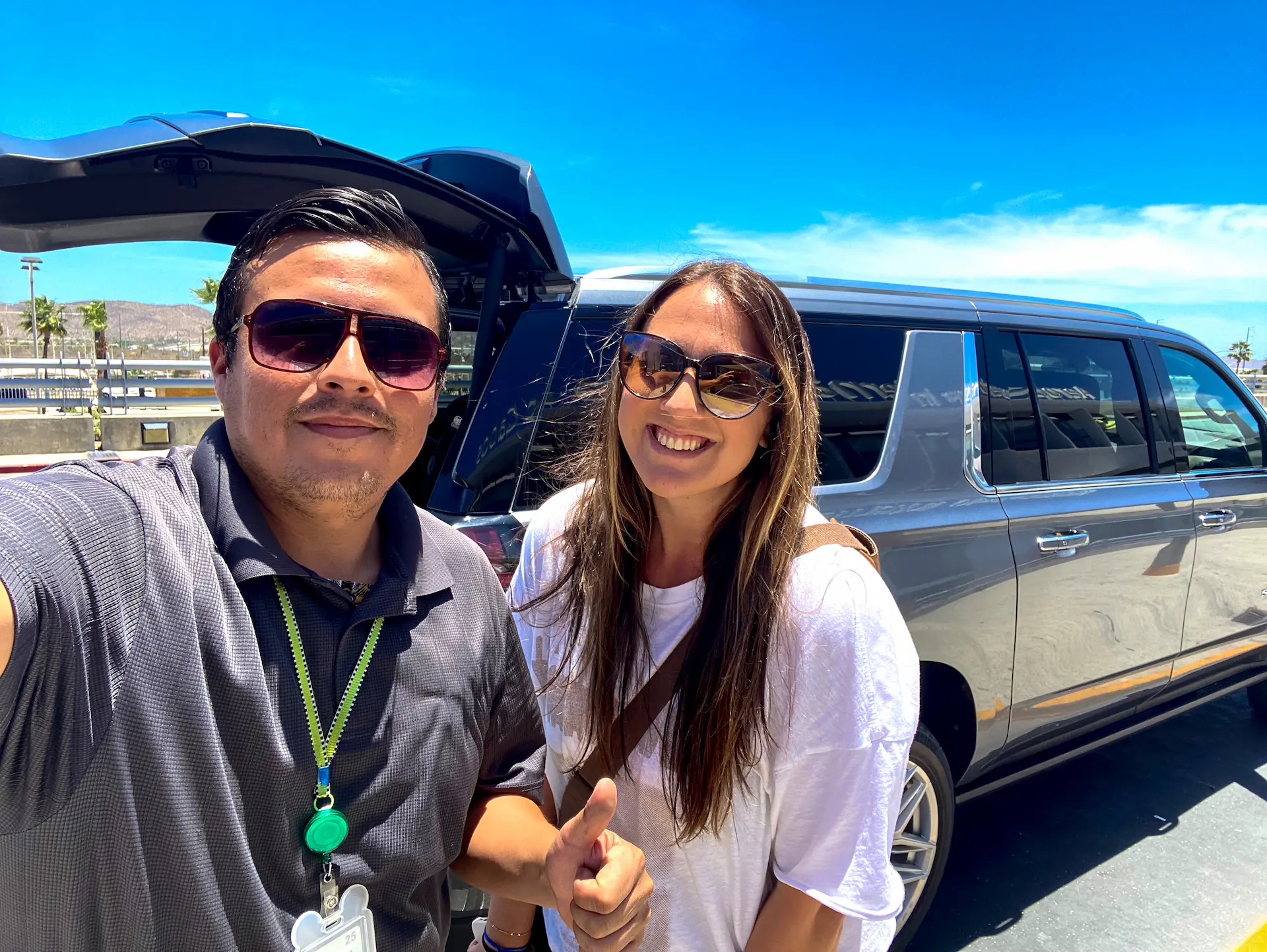 Driver greeting a guest at Cancun airport arrivals